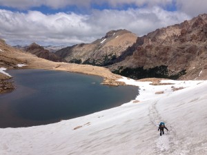 The steep snowfield leading to the top of the first pass. 