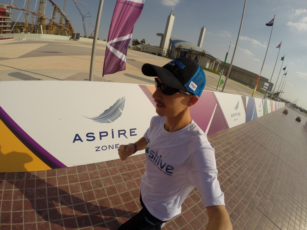 Running around the Aspire Zone - loving the sunshine and warmth, but not so much the hard brick!